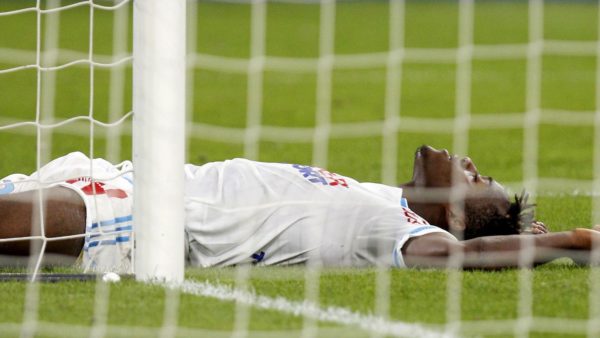 olympique-marseille-s-michy-batshuayi-lies-on-the-ground-during-their-french-ligue-1-soccer-match-against-caen-at-the-velodrome-stadium-in-marseille_5398195